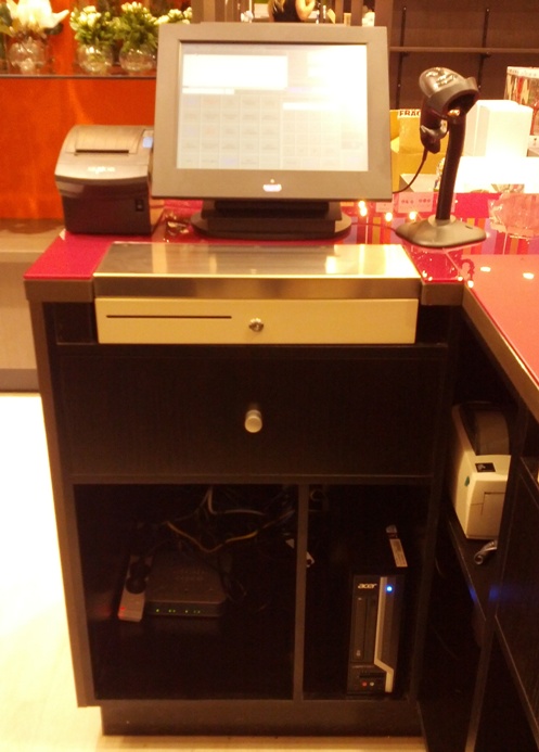 POS Terminal fitted into Store Counter showing cupboard and shelf design